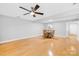 Bright dining room with hardwood floors and a four-person table at 9149 Washam Potts Rd, Cornelius, NC 28031