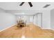 Bright dining room with hardwood floors and a four-person table at 9149 Washam Potts Rd, Cornelius, NC 28031