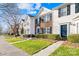 Row of townhouses with green lawns and sidewalks at 9149 Washam Potts Rd, Cornelius, NC 28031