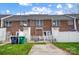 Rear view of brick townhouses with fenced yards at 9149 Washam Potts Rd, Cornelius, NC 28031