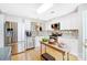 Updated kitchen featuring stainless steel appliances and wood-look floors at 9149 Washam Potts Rd, Cornelius, NC 28031