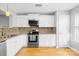 Modern kitchen featuring stainless steel appliances and granite countertops at 9149 Washam Potts Rd, Cornelius, NC 28031