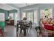 Breakfast nook with table and chairs, built-in window seat and access to back yard at 98 Poplar Woods Dr, Concord, NC 28027