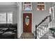 Interior view of front entry with hardwood floors and staircase at 98 Poplar Woods Dr, Concord, NC 28027