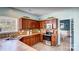 Spacious kitchen with wood cabinets, stainless steel appliances, and tile countertops at 98 Poplar Woods Dr, Concord, NC 28027