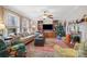 Cozy living room with a fireplace, built-in shelves, and bright windows at 1008 Candlewood Ln, Rock Hill, SC 29730