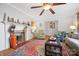 Comfortable living room featuring a fireplace, wood floors, and colorful decor at 1008 Candlewood Ln, Rock Hill, SC 29730