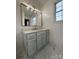 Modern bathroom with gray vanity, quartz countertop and gold fixtures at 129 Mapleleaf Rd, Statesville, NC 28625