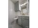 Updated bathroom with gray vanity, gold fixtures, and marble-look floor at 129 Mapleleaf Rd, Statesville, NC 28625