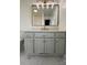 Modern bathroom with gray vanity, quartz countertop and gold fixtures at 129 Mapleleaf Rd, Statesville, NC 28625