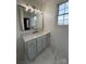 Modern bathroom with gray vanity, quartz countertop and gold fixtures at 129 Mapleleaf Rd, Statesville, NC 28625