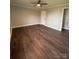 Spacious bedroom with wood-look floors and ceiling fan at 129 Mapleleaf Rd, Statesville, NC 28625