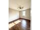 Well-lit bedroom with wood-look floors and ceiling fan at 129 Mapleleaf Rd, Statesville, NC 28625