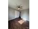 Spacious bedroom with wood-look floors and ceiling fan at 129 Mapleleaf Rd, Statesville, NC 28625