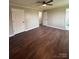 Bright bedroom featuring wood-look floors and multiple doors at 129 Mapleleaf Rd, Statesville, NC 28625