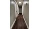 Long hallway with dark wood-look flooring and neutral walls at 129 Mapleleaf Rd, Statesville, NC 28625