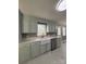 Renovated kitchen with light cabinets, quartz countertops, and stainless steel appliances at 129 Mapleleaf Rd, Statesville, NC 28625