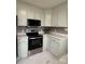 Renovated kitchen with stainless steel appliances and light cabinets at 129 Mapleleaf Rd, Statesville, NC 28625