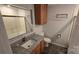 Bathroom vanity featuring granite countertop and wood cabinets at 1308 Princeton Ave, Gastonia, NC 28054