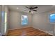 Bedroom with hardwood floors, ceiling fan and two windows at 1308 Princeton Ave, Gastonia, NC 28054