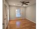 Bright bedroom with hardwood floors and a ceiling fan at 1308 Princeton Ave, Gastonia, NC 28054