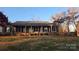 Brick ranch house with covered porch and landscaped yard at 1308 Princeton Ave, Gastonia, NC 28054