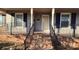 Inviting front porch features brick steps, black iron railings, and classic columns at 1308 Princeton Ave, Gastonia, NC 28054