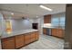 Open-concept kitchen featuring a granite island, stainless steel appliances, and wood cabinets at 1308 Princeton Ave, Gastonia, NC 28054