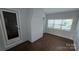 Bright sunroom with ample natural light, a white-painted brick wall, and neutral paint colors at 1308 Princeton Ave, Gastonia, NC 28054