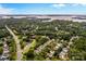 Aerial view of neighborhood, highlighting home's location near lake at 19830 Madison Village Dr # 65, Cornelius, NC 28031