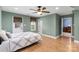 Light-filled bedroom with wood flooring and ceiling fan at 19830 Madison Village Dr # 65, Cornelius, NC 28031