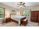 Spacious bedroom with a wooden bed frame and ample closet space at 19830 Madison Village Dr # 65, Cornelius, NC 28031