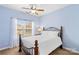 Light blue bedroom with a ceiling fan and a comfortable bed at 19830 Madison Village Dr # 65, Cornelius, NC 28031