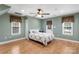 Serene bedroom with wood flooring, ceiling fan and plenty of light at 19830 Madison Village Dr # 65, Cornelius, NC 28031