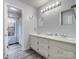 Double vanity bathroom with updated fixtures and grey flooring at 2430 Lazy Oak Dr, Lancaster, SC 29720