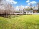 House with a fenced yard and trees in background at 2430 Lazy Oak Dr, Lancaster, SC 29720