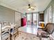 Sunroom with table, chairs, and ceiling fan, overlooking wooded area at 2430 Lazy Oak Dr, Lancaster, SC 29720