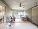 Bright sunroom with wicker furniture and a dining table at 2430 Lazy Oak Dr, Lancaster, SC 29720