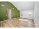 Bright living room features wood floors, a vaulted ceiling, and a modern two-tone color palette at 2503 Parnell Dr, Shelby, NC 28150