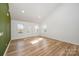 Bright living room features wood floors, a vaulted ceiling, and a fresh, neutral palette at 2503 Parnell Dr, Shelby, NC 28150