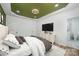 Spacious main bedroom with light-colored wood flooring, a modern TV, and a luxurious attached bathroom at 2503 Parnell Dr, Shelby, NC 28150