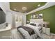 Staged main bedroom featuring a decorative ceiling, stylish bed, and natural light from the window at 2503 Parnell Dr, Shelby, NC 28150