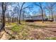 View of the house from the backyard showcasing a large deck and fenced yard at 2544 Harmony Rd, Rock Hill, SC 29730