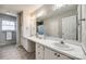 Large bathroom with double sink vanity, ample cabinet space and a well lit large mirror at 2544 Harmony Rd, Rock Hill, SC 29730