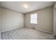 Bright bedroom with a window providing natural light and wood look floors at 2544 Harmony Rd, Rock Hill, SC 29730