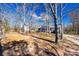 A view of a home with a large treed lot and a paved driveway at 2544 Harmony Rd, Rock Hill, SC 29730