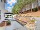 Backyard with deck, pergola, and wooded area at 2565 Meadow Crossing Dr, Dallas, NC 28034