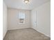 Small bedroom with window and neutral decor at 2565 Meadow Crossing Dr, Dallas, NC 28034