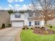 Two-story house with attached garage and landscaped yard at 2565 Meadow Crossing Dr, Dallas, NC 28034