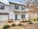 Two-story home with stone accents and landscaping at 2565 Meadow Crossing Dr, Dallas, NC 28034